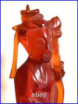 Antique Chinese Qing Dynasty Cherry Amber Figure of Quan Lin